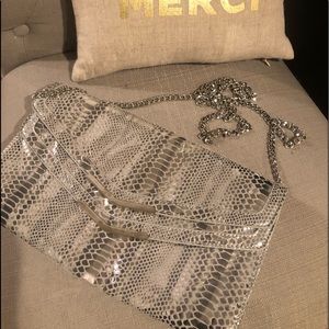 White House Black Market… silver clutch NWOT